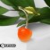 Brooch "Cherry" with a leaf, the color of orange-green in gold