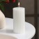 Candle-cylinder with faces, 5x10 cm, white, 6 hours