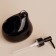 A soap dispenser with a Savanna drop sponge stand, 450 ml, black color