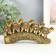 Polystone souvenir "Five elephants on a tusk with flowers" bronze 17x4x8 cm