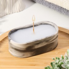 A candle in an oval candlelight made of gypsum, 9.5x4.7x3cm, marble with black stripes