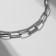 The molestrous “chain” is elongated, the color of silver