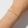 Bracelet "ice" 1 row, white color in gold, 7 cm