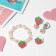 Set of children's "chosen" 3 subjects: clips, bracelet, ring, strawberries, colored