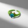 Ring "Montrustrik" with horns, the color is green, dimensionless
