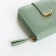 Women's wallet on the button, green color