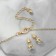 Set 2 objects: earrings, pendant “heart” curved, white color in gold, 40 cm