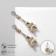 Earms with Eiffel Tower Rhinas, white color in gold