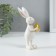 Souvenir Polystone "Easter rabbit with a gold egg" 4x4x13 cm