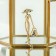 Brooch "Lady" with a handbag, the color is red-white in gold