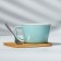 Ceramic mug on a stand with a spoon "Bear", 230 ml, beige color