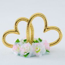 Hearts with flowers are pale pink. Fixed to the ribbons