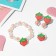 Set of children's "chosen" 3 subjects: clips, bracelet, ring, strawberries, colored