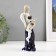 Souvenir porcelain angel with a cobalt drum 20cm