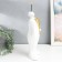 Souvenir Polystone stand "A man with a bird on the head" White 16x38 cm
