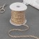 The braid of the finishing “Blutchik” with a gold thread, 5 mm, 27 ± 1 m, beige color