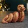 Figure "Snake Spiral" burgundy with gilding, 4x7x4cm