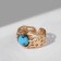 Ring "turquoise world" relief, color gold, dimensionless