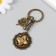 A metal keychain, glass with a carbine "Flower and patterns in the medallion" Bronze 9.5 cm