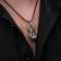 Unisex “Fist” pendant, black silver color on a black lace, 60 cm