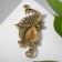 Brooch "Peacock" elegant, colored in black gold