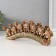 Souvenir Polystone "Seven African elephants in the gold, openwork blanket" 10.7x29x4 cm