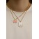 Kulons "Demetrons" cat with a bow, white-pink color in gold, 45 cm