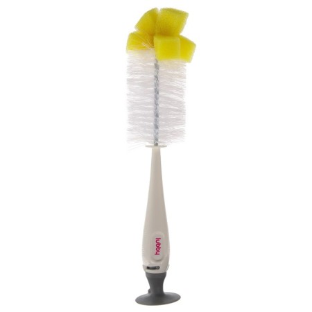 A set of brushes for washing bottles and children's dishes on a suction cup