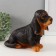 The piggy bank "Dachshund" is 19 cm height, width 11 cm, length 23 cm.