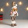 Interior doll "Boy in a white vest and beige cap" 48x10x15 cm
