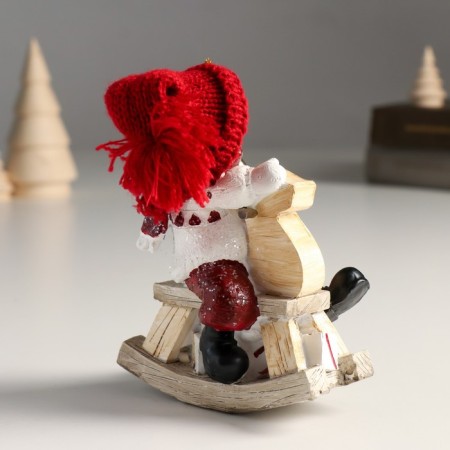 Polystone souvenir "Baby in a large red hat on a toy-rocking toy" 6x10x13 cm-4