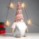 Interior light doll "Santa Claus Luminous nose, in a pink cap with patterns" 33x17x12 cm