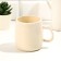 Ceramic mug with a lid and a spoon “every day is beautiful”, 450 ml, beige color