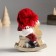 Polystone souvenir "Baby in a large red hat on a toy-rocking toy" 6x10x13 cm