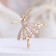 Brooch "Ballerina" with beads, white color in gold