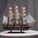 The ship souvenir medium "Fugas", sides dark with a white strip, 45x50x9 cm, mix