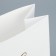 A package without handles “Happy New Year”, white, with embossing, 10 x 19.5 x 7 cm, New Year