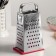 A heap with a doser lid and a side for cheese, a metal pen, color mix