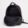 A backpack with a zipper, "saxi", a laptop department, black color