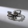 The ring "Smiley", the color is black silver, dimensionless