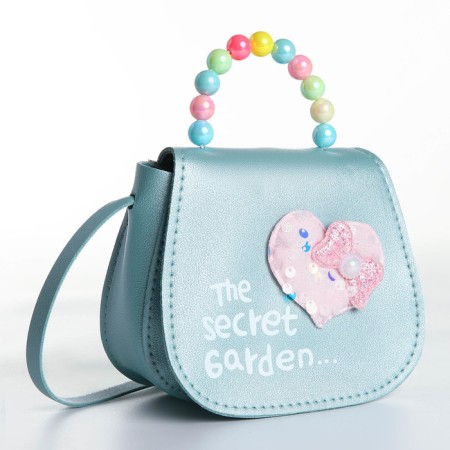 Baby bag on a magnet, the color is turquoise