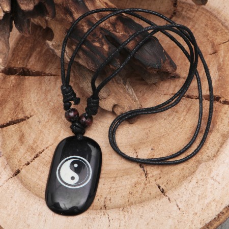 Yin-Yang's pendant cooler, brown-black color on a black lace, 40-80 cm