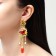 Hanging earrings "Flowering", colored in gold