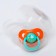 A container for storing and sterilizing children's nipples and dummies "Tigeron", color mix