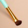 A set of makeup brushes, 4 objects, turquoise/golden color