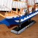 The ship souvenir medium “Corsica”, the sides are blue with a white strip, white sails, 43x8.5x37 cm