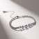 Bracelet with rhinestones "Zircon" Izk, arc, white color in silver, 15cm