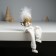 Souvenir Polystone "Angel in a white outfit, in a hat with fluff" sits 6x4x15 cm