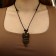 A pendant on the lace "Filin", the color is brown-black on a black lace, 80 cm