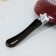 The “Expert” pan, D = 24 cm, plastic handle, anti -stick coating, burgundy color